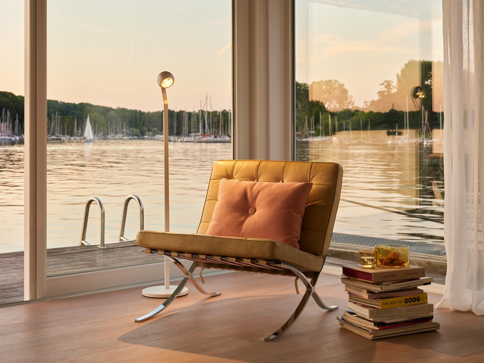 White Cube houseboat exterior at golden hour on the Berlin Havel
